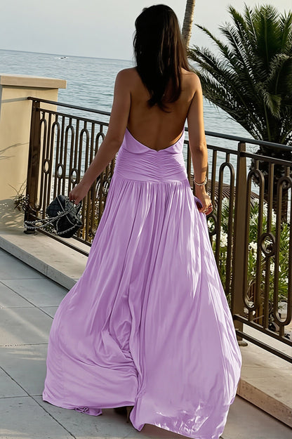 Dames halter maxi jurk met open rug en vloeiende rok, zijaanzicht