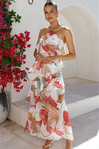 Vooraanzicht van een dames maxi jurk met ruches en halterdetail