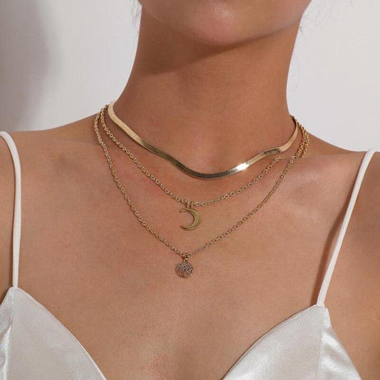 Gelaagde damesketting met hanger van een levensboom en halve maan