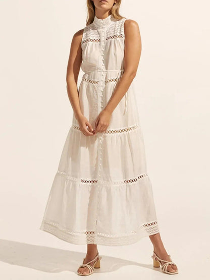 Mouwloze midi-jurk met oogjesstof en open details