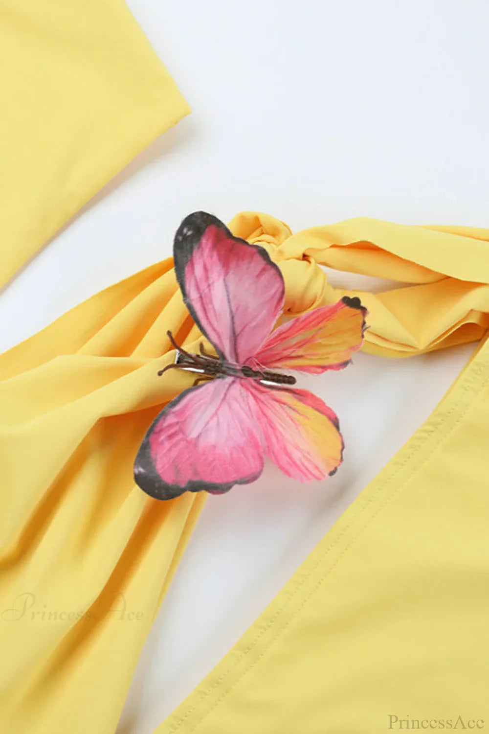 Dames mini jurk met cut out en strikdetail vanuit een andere hoek